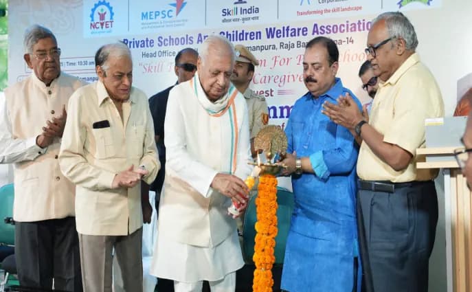 Guests light a ceremonial lamp at a skill training programme for pre-school teachers and caregivers